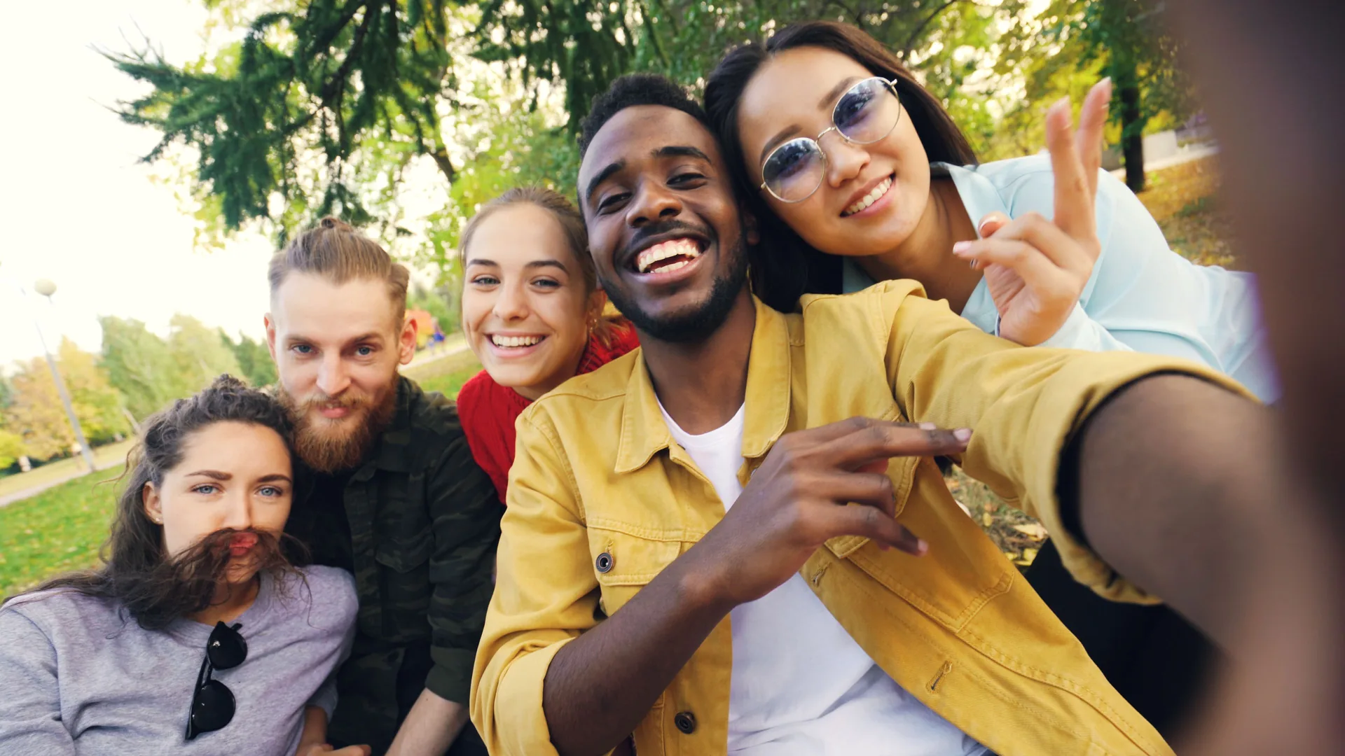 Friends taking a selfie in an autumn park